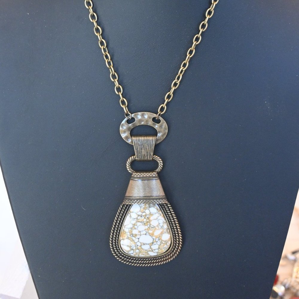 Necklace, two sets of earrings, bracelet and ring.